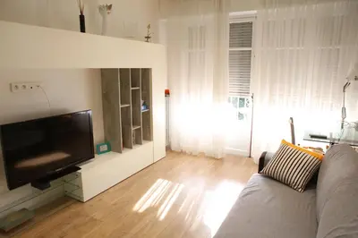 a living room with a couch and a flat screen tv at Modern Appart Nice, proche Gare Riquier in Nice