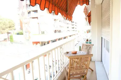 a balcony with two chairs and a table on it at Modern Appart Nice, proche Gare Riquier in Nice