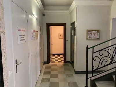 a hallway with a door and a staircase at Easy and accessible beach flat near the university in Nice
