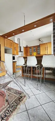 a kitchen with a table and chairs in it at Spacious apartment in Cimiez in Nice