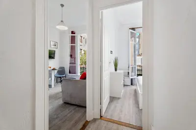 a living room with a couch and a table at Appartement Perle - Welkeys in Nice