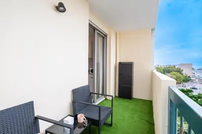a balcony of a building with green grass at Azur Stay 3 Start Beach 8 min Tram Airport 5m in Nice