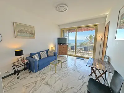a bathroom with a glass shower and a sink at Riviera Escape Promenade Nice in Nice