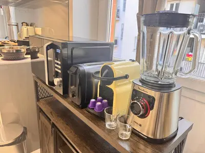 a kitchen with a blender on a counter at Bright, Central & Stylish 3 Min Walk to the Sea in Nice