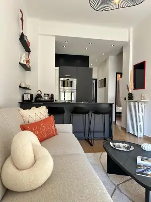a living room with a couch and a table at Chic et confort- Nice- 3 à 5 personnes in Nice