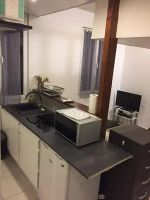 a kitchen with a counter top with a microwave at Charmant studio Nice in Nice