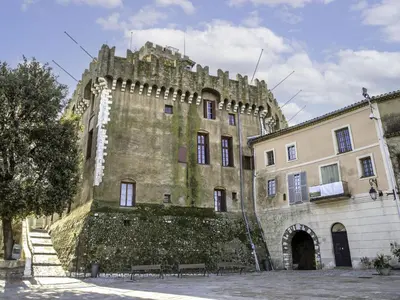 an old building with a stone wall next to a building at Studio Le Bali by Interhome in Cagnes-sur-Mer