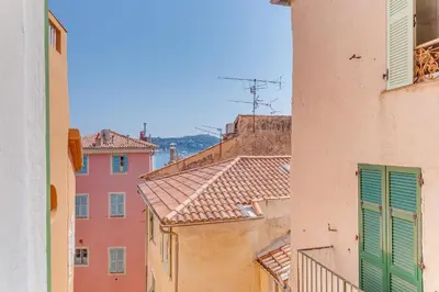 a view of an alley between two buildings at AUTHENTIC VILLEFRANCHE AP4472 By Riviera Holiday Homes in Villefranche-sur-Mer