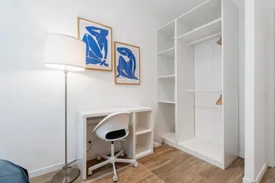 a white bedroom with a desk and a chair at Nice Renting - REPUBLIQUE - Garibaldi Chic 3 Bedrooms 3 Bathrooms Balcony AirCon in Nice