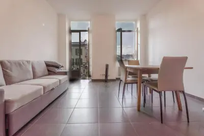 a living room with a couch and a table at Le Malausséna in Nice