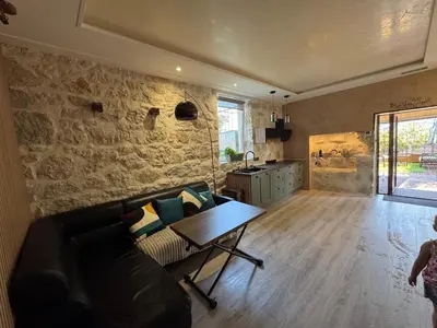 a living room with a couch and a table at Terrasse de Cimiez in Nice