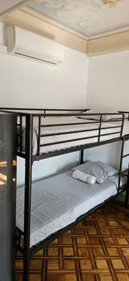 two bunk beds in a room with a ceiling at Villa Nanou Riviera in Nice