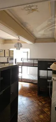 a bedroom with bunk beds in a room with a ceiling at Villa Nanou Riviera in Nice