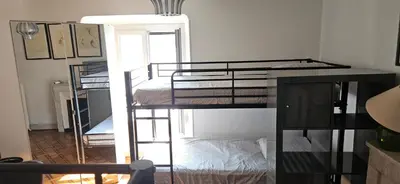 a room with three bunk beds in a room at Villa Nanou Riviera in Nice