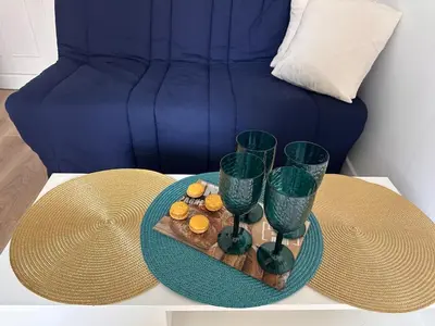 a table with a tray of food and two wine glasses at Appartement rénové Vieux Nice in Nice