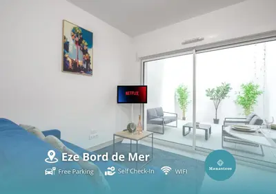 an image of a living room with a tv at Appartement neuf - Patio intérieur - Parking - EF in Èze