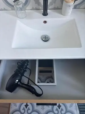 a white bathroom sink with a black pipe under it at Renovated F3 Parking Clim Nice Mont Boron in Nice