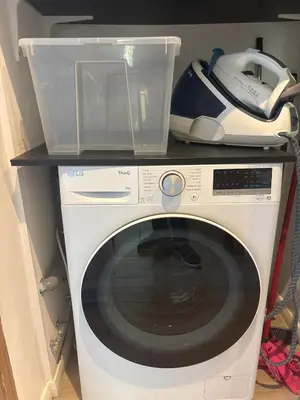 a microwave sitting on top of a washing machine at Renovated F3 Parking Clim Nice Mont Boron in Nice
