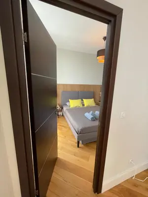 a bedroom with a bed and a mirror at Villa Katerina - Luxury Apartment in Nice