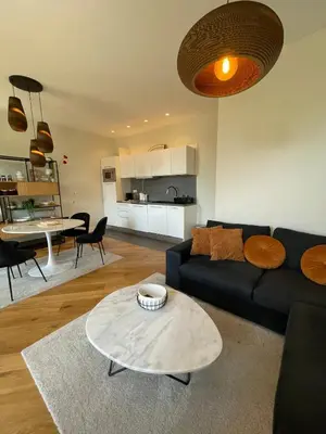 a living room with a couch and a table at Villa Katerina - Luxury Apartment in Nice