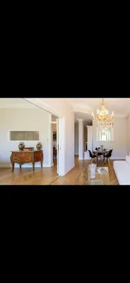 a living room with a couch and a table at Le Grand Bourgeois à Nice in Nice
