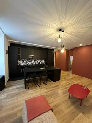 a living room with a couch and a table at Heart of Nice Beautiful apartment 3 bedrooms in Nice