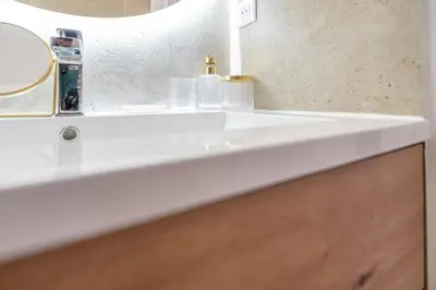 a bathroom sink with two soap dispensers on it at Azzuro - Mare e Terrazza in Nice