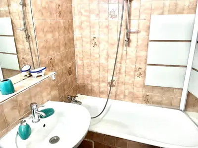 a bathroom with a shower and a sink and a tub at Studio Californie in Nice