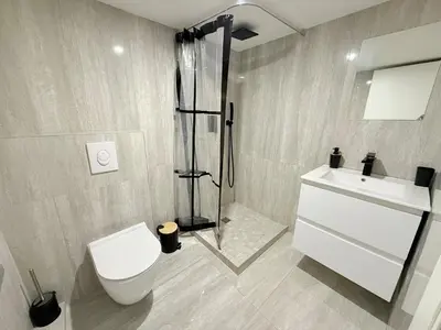 a bathroom with a shower and a toilet and a sink at Duplex cosy dans la Vieille Ville in Nice
