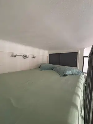 a bedroom with a large bed in a room at Studio proche gare in Nice
