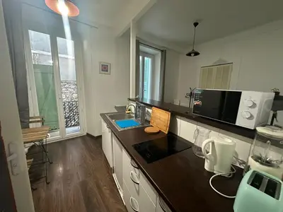 a kitchen with a counter top with a microwave at Studio Rue Bonaparte in Nice
