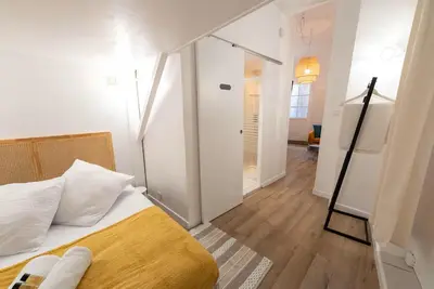 a bedroom with a bed and a walk in closet at Studio 4 couchages in Nice