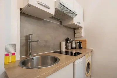 a kitchen with a sink and a counter top at Studio 4 couchages in Nice
