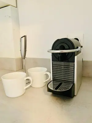 a coffee maker with two cups on a counter at Modern Studio by Port & Old Town in Nice