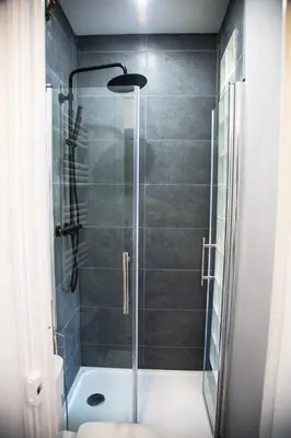 a shower with a glass door in a bathroom at Studio port de Nice in Nice