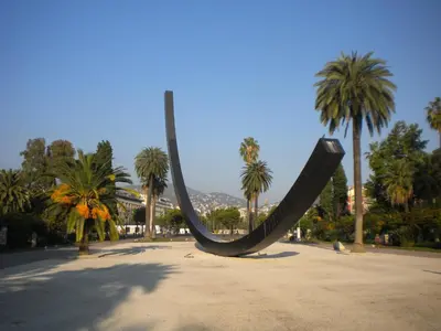a slide in the middle of a park with palm trees at Nice Renting - PAGANINI - New Lovely Cosy Flat in Heart of Nice in Nice