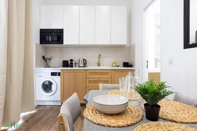 a bathroom with a white sink and a mirror at WeHost D2 - Smart & chic loft, 3 mins to beaches in Nice