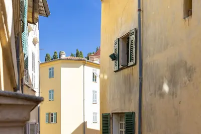 a view of an alley between two buildings at Nice Renting - COLLET - Cocoon Design Old Nice Beach Massena Saleya in Nice