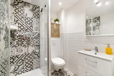 a white bathroom with a toilet and a shower at Nice Renting - COLLET - Cocoon Design Old Nice Beach Massena Saleya in Nice