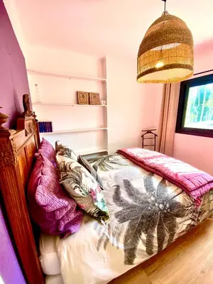 a bedroom with two beds and a large mirror at Villa Nice Côte d'Azur piscine privée rez de chaussée in La Gaude