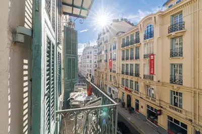 a view from a balcony of a city with buildings at 44 LAMARTINE - Charmant 2 pieces - Centre-ville in Nice