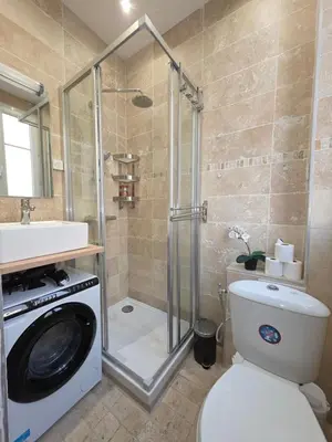 a bathroom with a shower and a toilet and a sink at Cozy studio, balcony & AC, Heart of Nice in Nice
