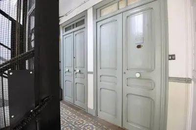 a pair of white doors in a hallway at Nice Signature The Port in Nice