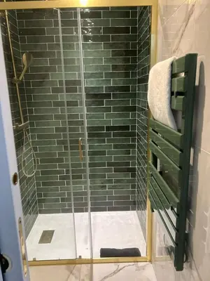 a shower with a glass door in a bathroom at MOON 26 - Appartement Nice 6P in Nice