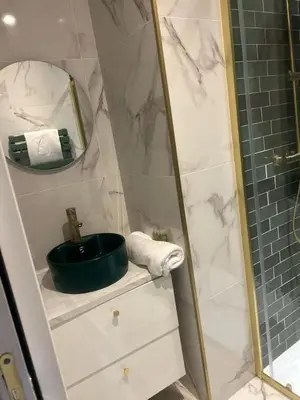 a bathroom with a shower with a sink and a mirror at MOON 26 - Appartement Nice 6P in Nice