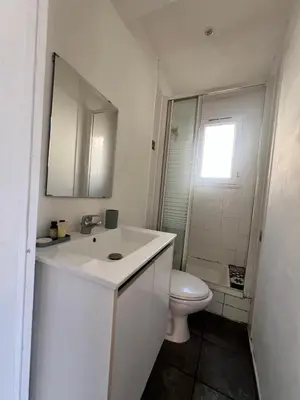 a white bathroom with a sink and a toilet at Charmant et cosy 3pcs in Nice