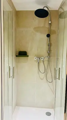 a shower with a shower head in a bathroom at Palais Clerissy - Appartement 2 à 4 personnes centre ville Nice in Nice