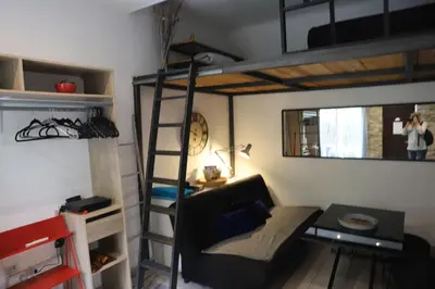 a living room with a loft bed and a couch at Cozy apartment in Nice Est in Nice