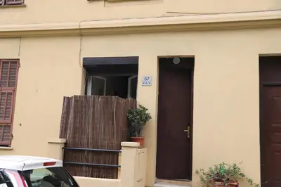 a house with a door and a plant in it at Cozy apartment in Nice Est in Nice