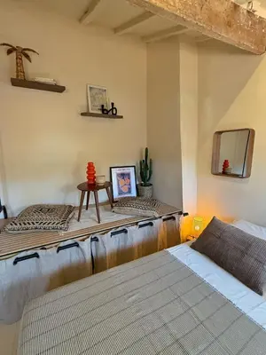 a room with two beds and a table in it at Studio Place Rossetti - Old Nice Center in Nice